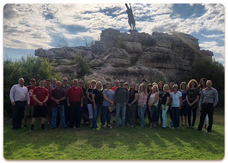 Heber-Overgaard Unified School District Number 6 staff members pose outside together